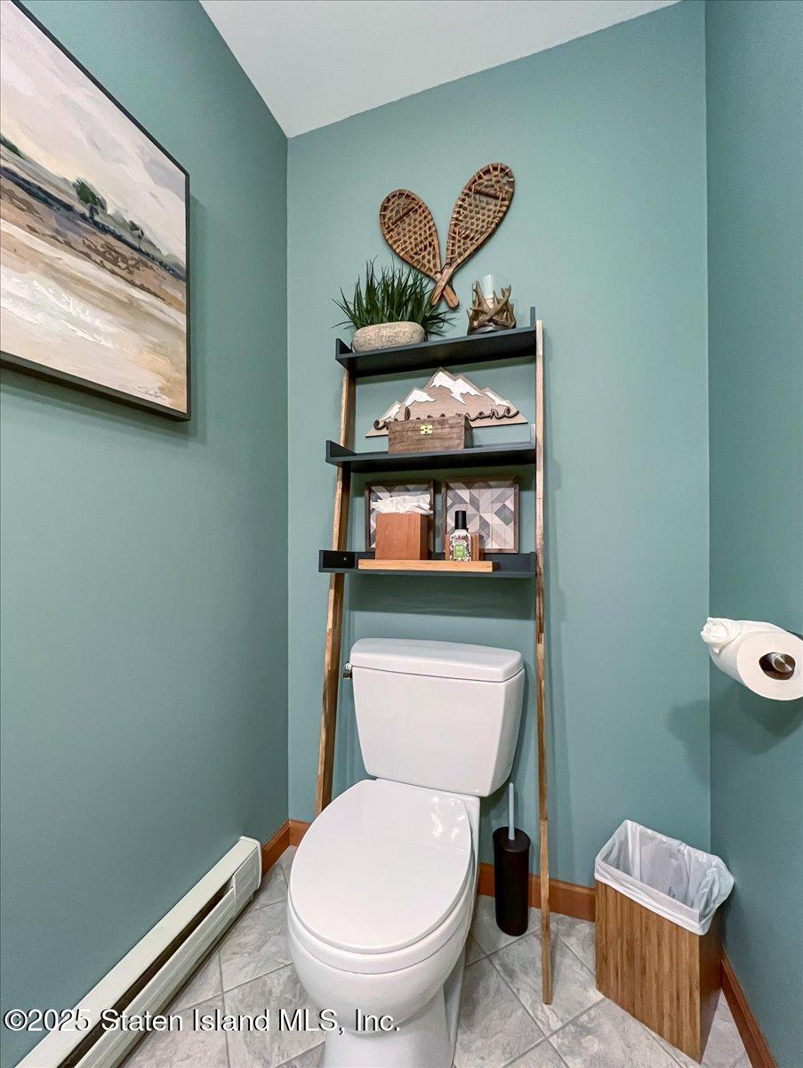 134 Split Rock Road Dingmans Ferry, PA 18328 - Photo 29 of 84 a bathroom with a toilet a sink and a mirror
