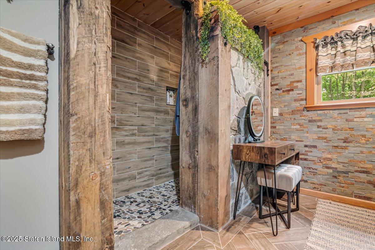 134 Split Rock Road Dingmans Ferry, PA 18328 - Photo 34 of 84 a view of a door and chair in the balcony