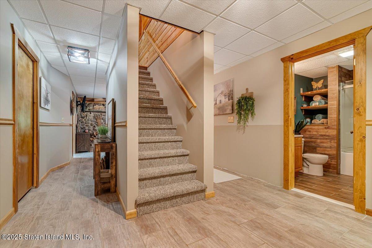 134 Split Rock Road Dingmans Ferry, PA 18328 - Photo 38 of 84 a view of entryway with wooden floor and stairs