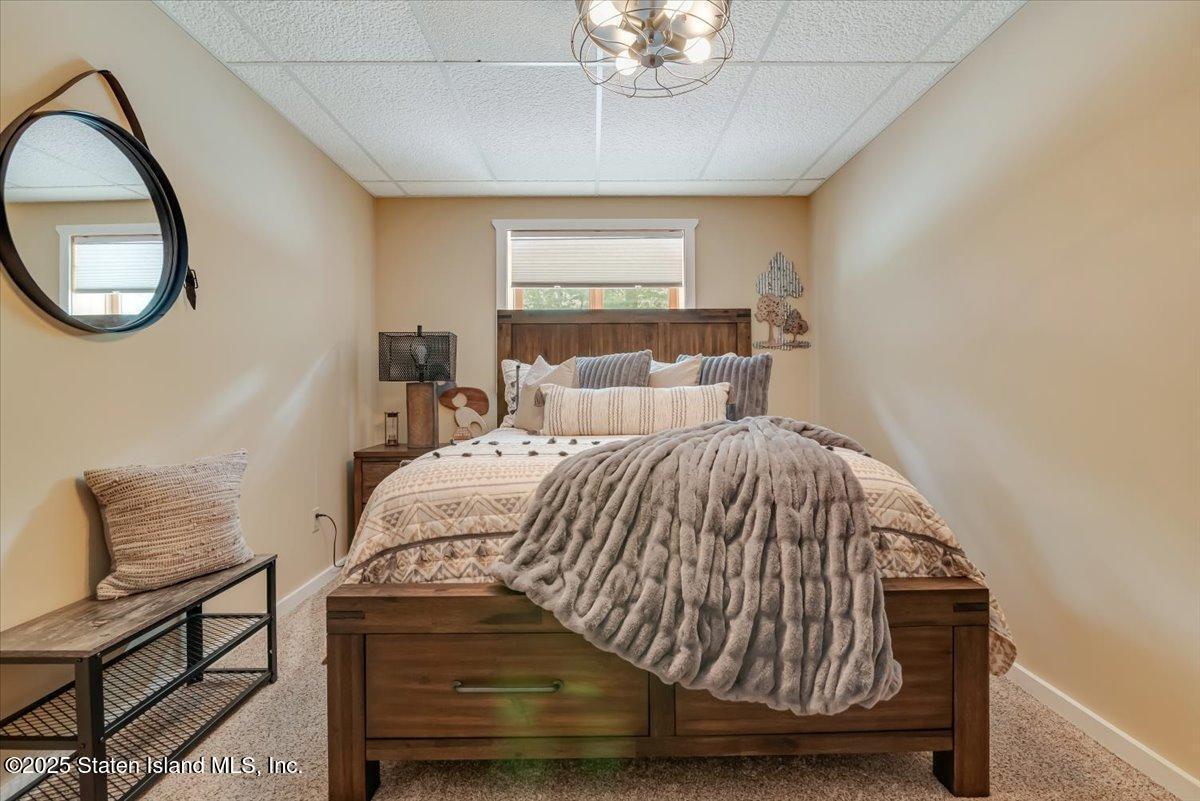 134 Split Rock Road Dingmans Ferry, PA 18328 - Photo 39 of 84 a bedroom with a bed and a window