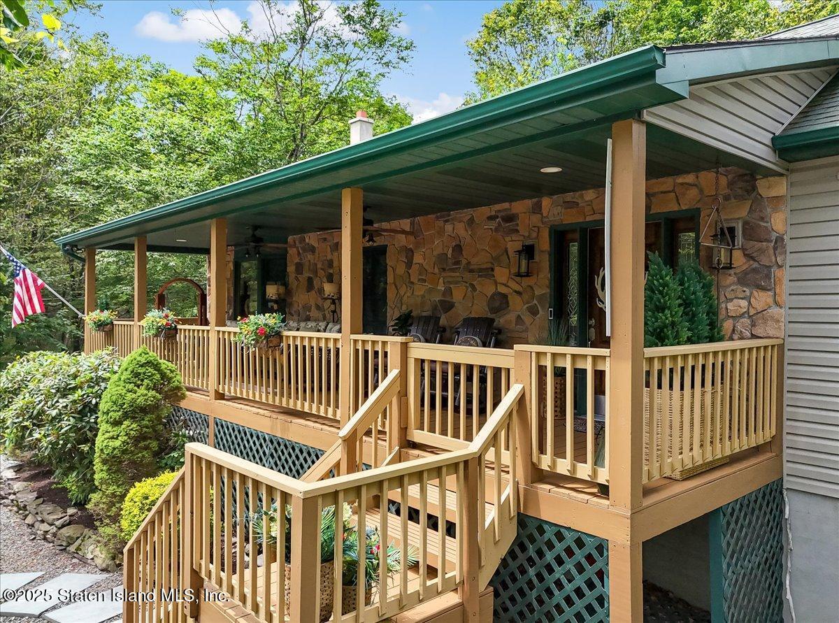 134 Split Rock Road Dingmans Ferry, PA 18328 - Photo 4 of 84 a view of a house with backyard and deck