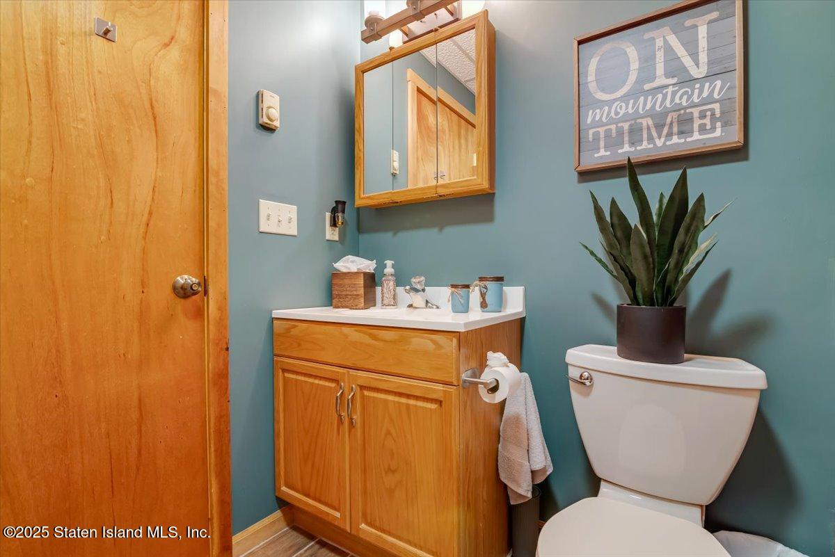 134 Split Rock Road Dingmans Ferry, PA 18328 - Photo 46 of 84 a bathroom with a toilet and a sink