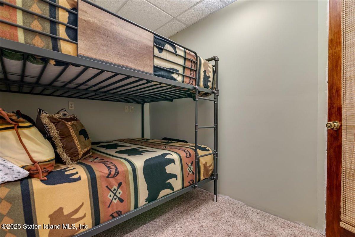 134 Split Rock Road Dingmans Ferry, PA 18328 - Photo 50 of 84 a bed room with a bed and a window