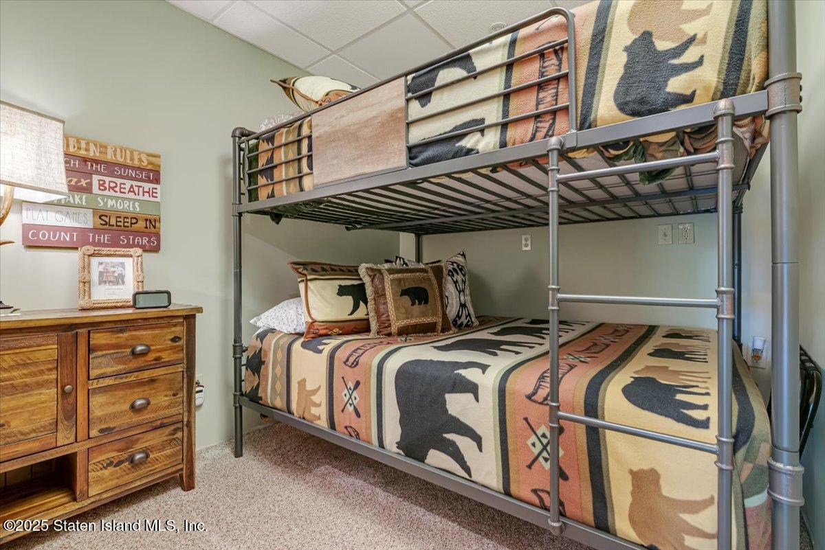 134 Split Rock Road Dingmans Ferry, PA 18328 - Photo 51 of 84 a bed room with a bed and a painting on the wall