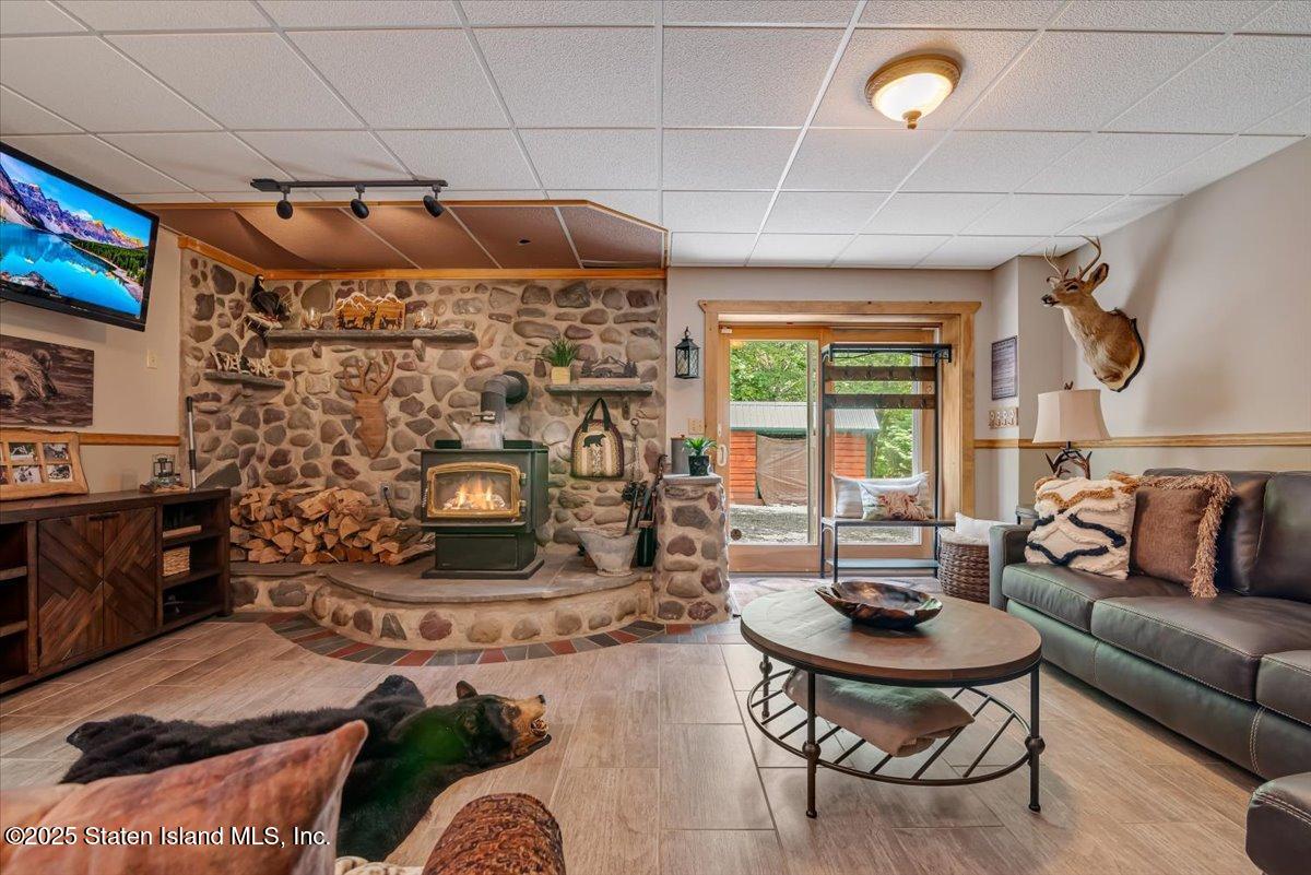 134 Split Rock Road Dingmans Ferry, PA 18328 - Photo 53 of 84 a living room with furniture and a fireplace