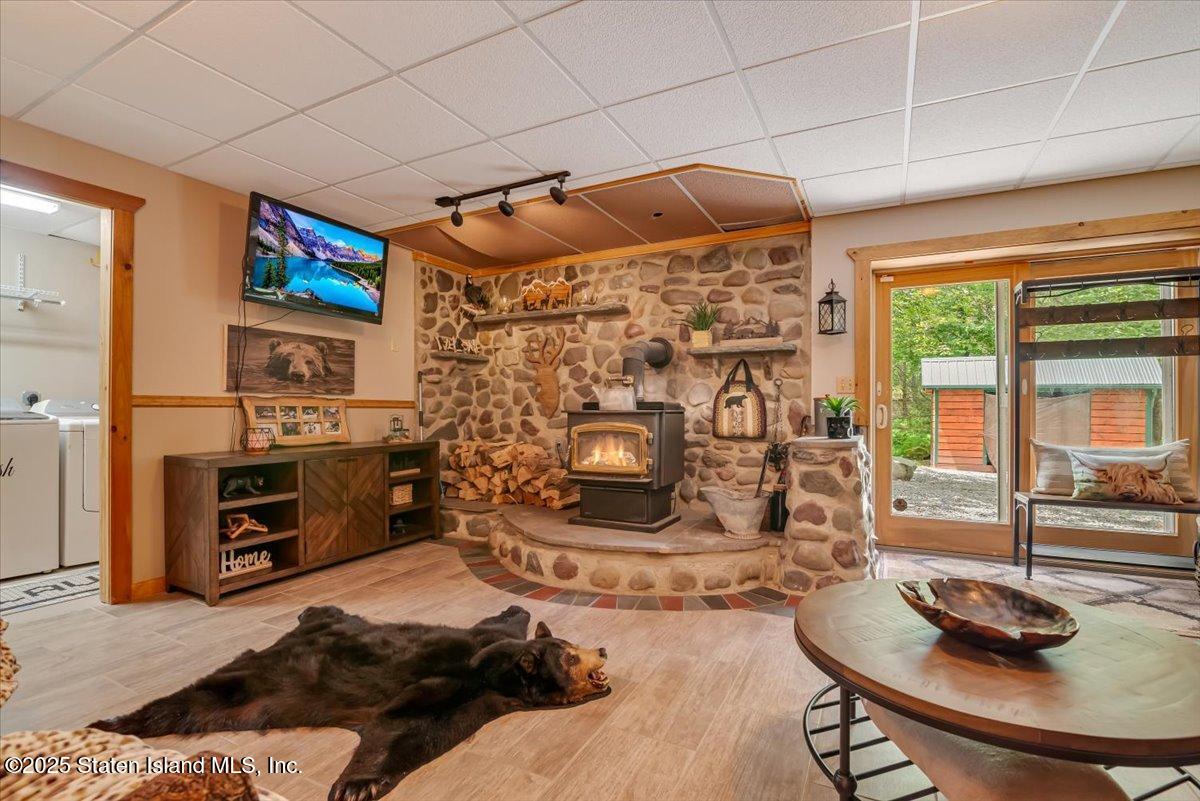134 Split Rock Road Dingmans Ferry, PA 18328 - Photo 54 of 84 a living room with furniture and a fireplace