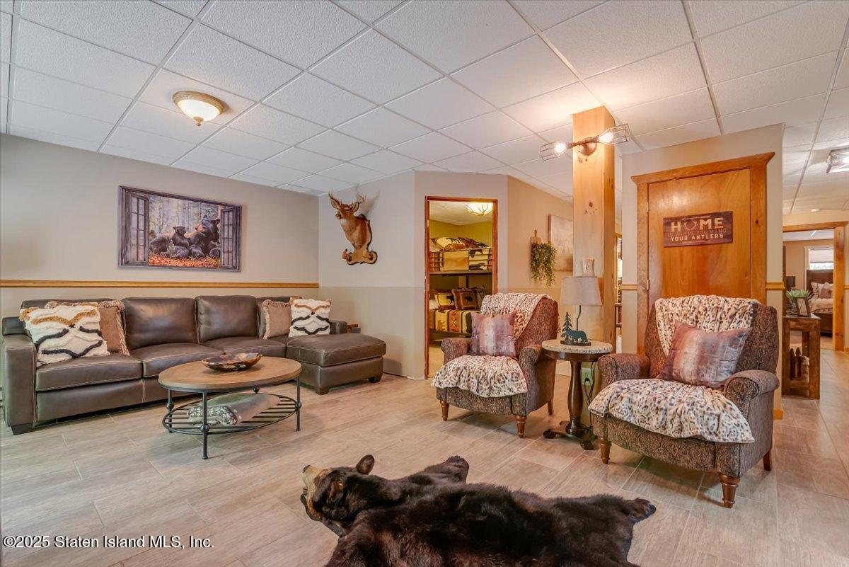 134 Split Rock Road Dingmans Ferry, PA 18328 - Photo 56 of 84 a living room with furniture and a lamp