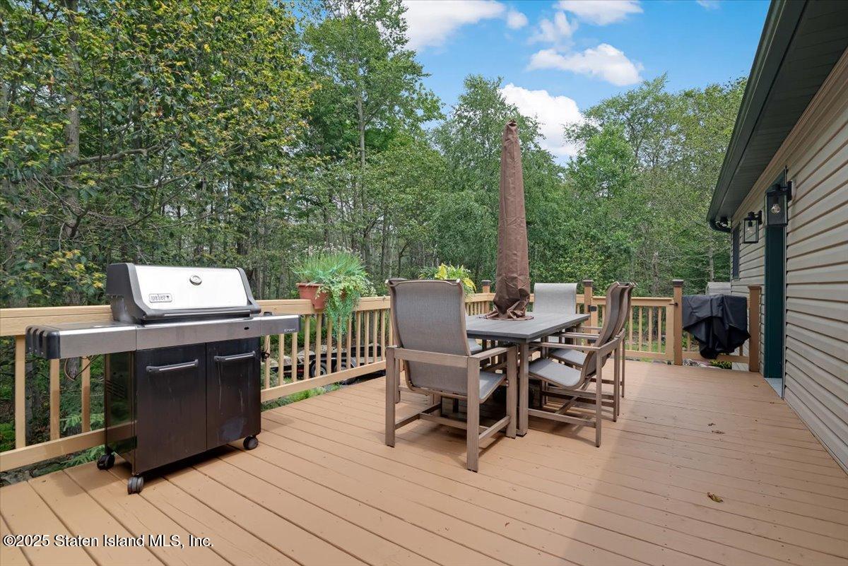 134 Split Rock Road Dingmans Ferry, PA 18328 - Photo 61 of 84 a view of a dinning table and chairs in the balcony