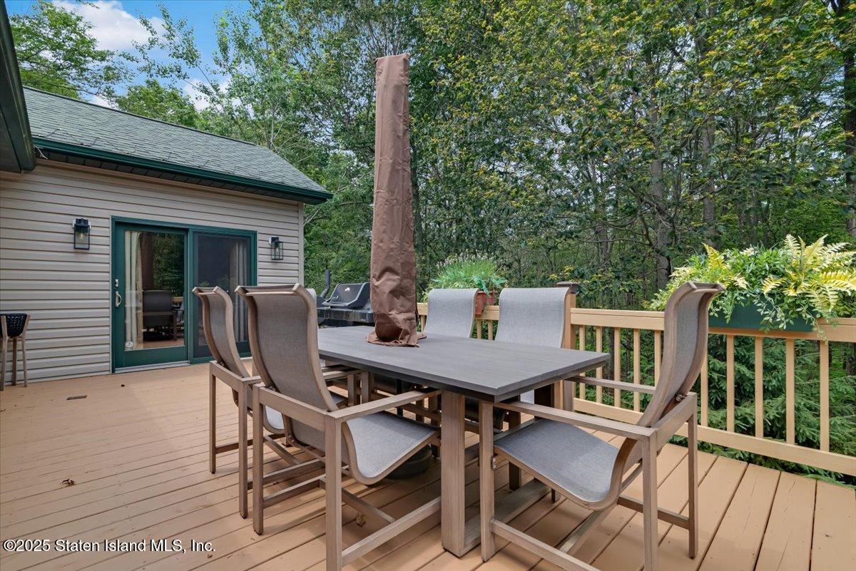134 Split Rock Road Dingmans Ferry, PA 18328 - Photo 62 of 84 a view of a patio with a table and chairs