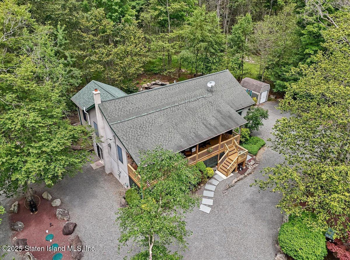134 Split Rock Road Dingmans Ferry, PA 18328 - Photo 77 of 84 an aerial view of a house with a yard and a large tree