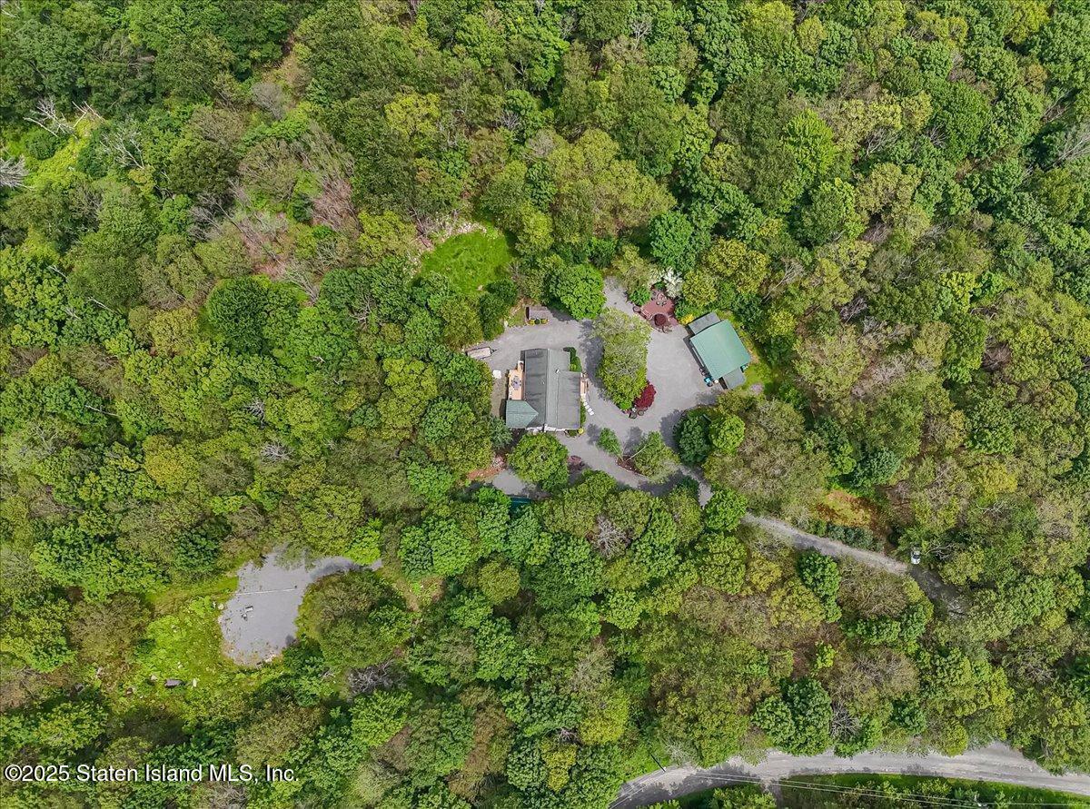 134 Split Rock Road Dingmans Ferry, PA 18328 - Photo 84 of 84 an aerial view of residential house with outdoor space and trees all around