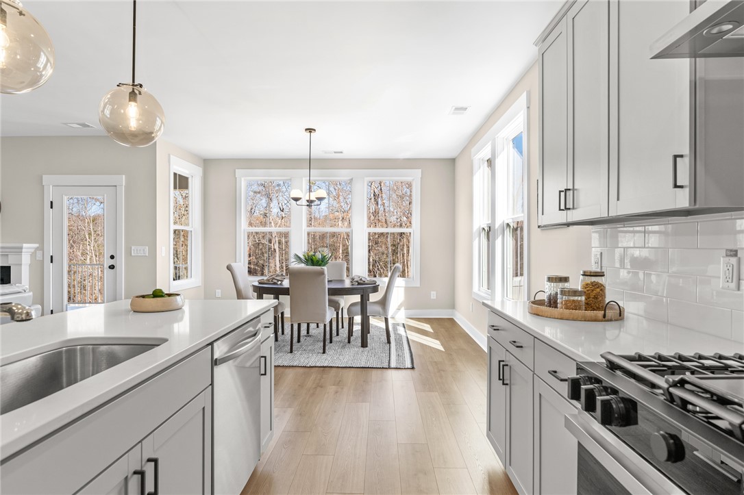 Tbd Split Oak Circle Seneca, SC 29678 - Photo 6 of 8 This bright kitchen and dining area offers spacious living with ample natural light.