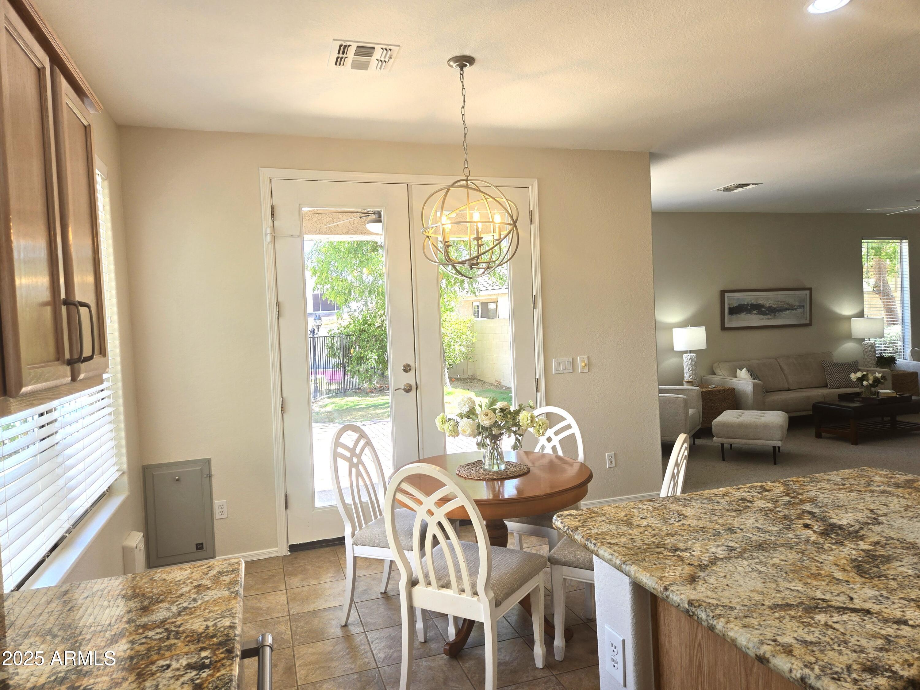 1187 South Hazel Street Gilbert, AZ 85296 - Photo 11 of 50 a view of a dining room with furniture window and outside view