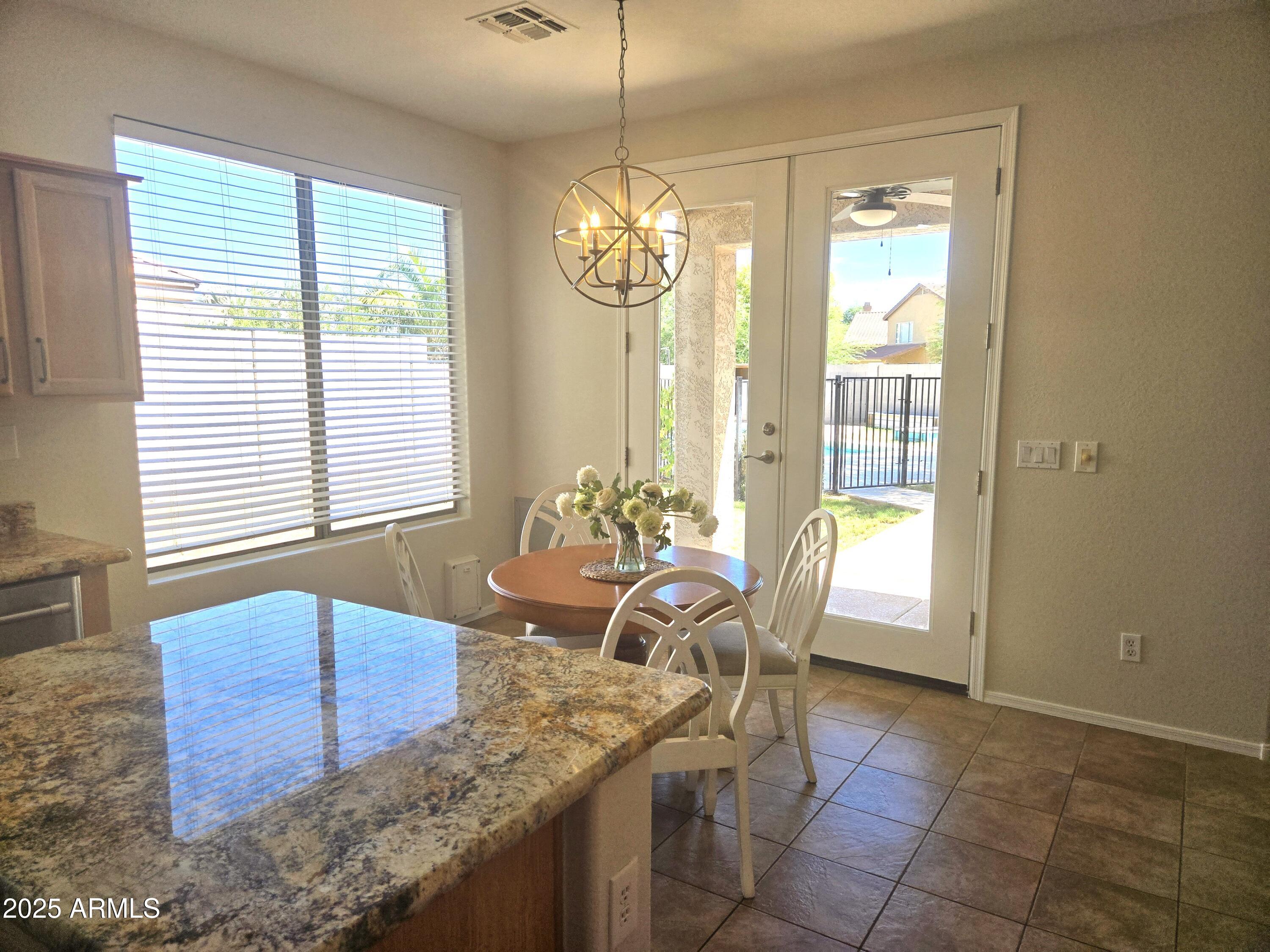 1187 South Hazel Street Gilbert, AZ 85296 - Photo 16 of 50 a view of a dining room with furniture and window