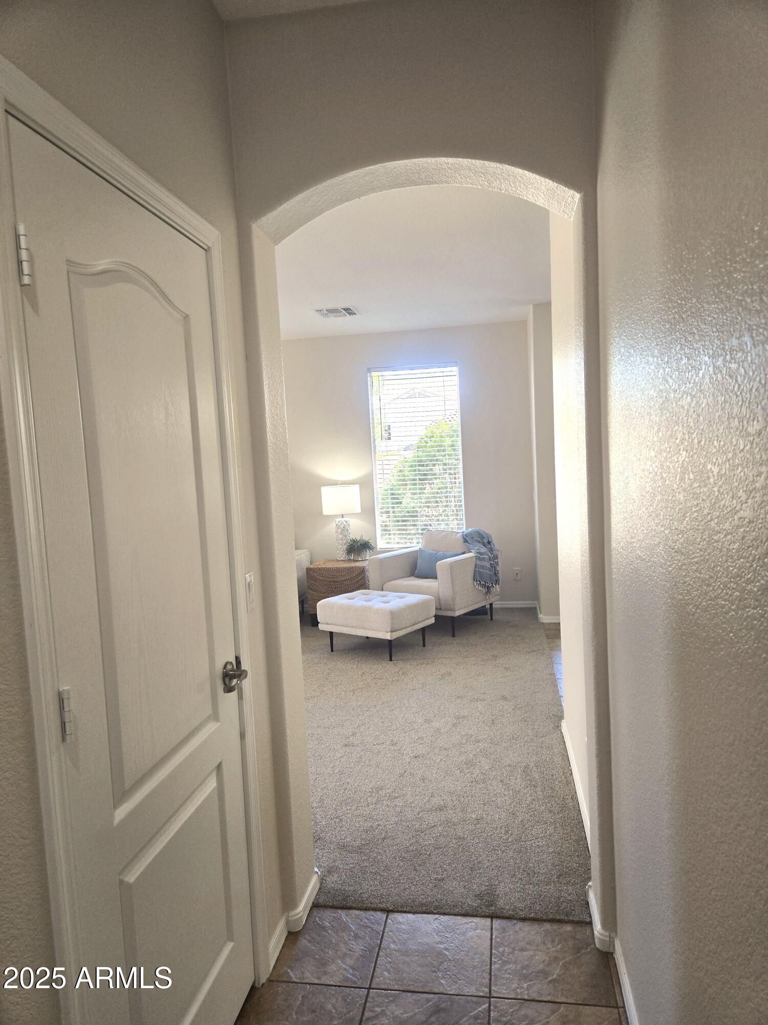 1187 South Hazel Street Gilbert, AZ 85296 - Photo 17 of 50 a view of living room with furniture and front door