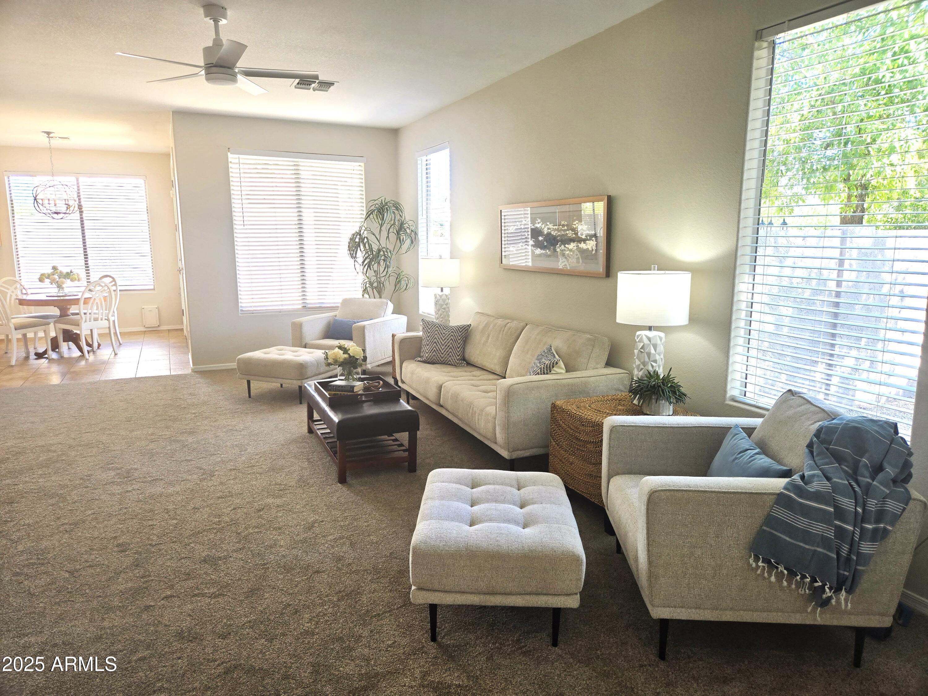 1187 South Hazel Street Gilbert, AZ 85296 - Photo 2 of 50 a living room with furniture and a large window
