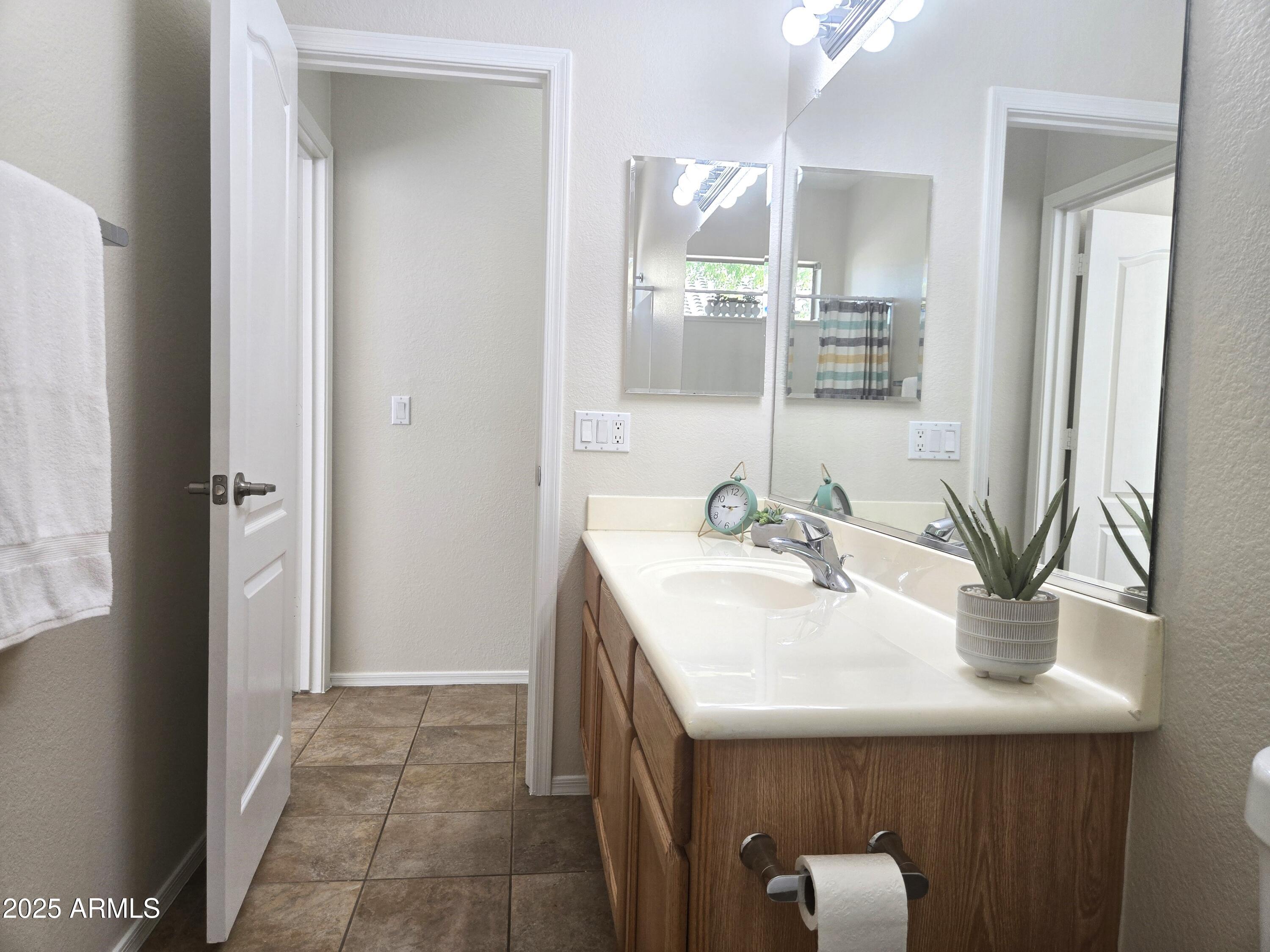 1187 South Hazel Street Gilbert, AZ 85296 - Photo 33 of 50 a bathroom with a sink and a mirror