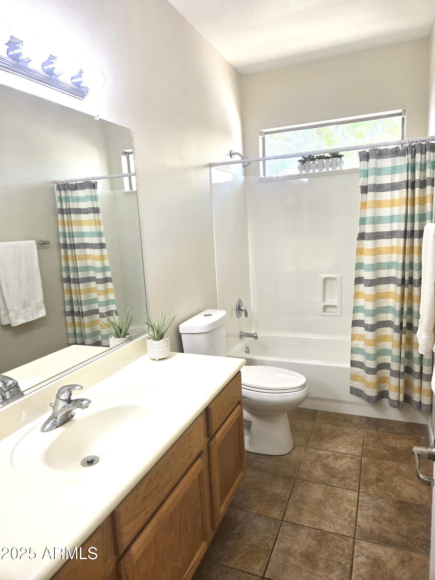 1187 South Hazel Street Gilbert, AZ 85296 - Photo 34 of 50 a bathroom with a sink toilet and shower