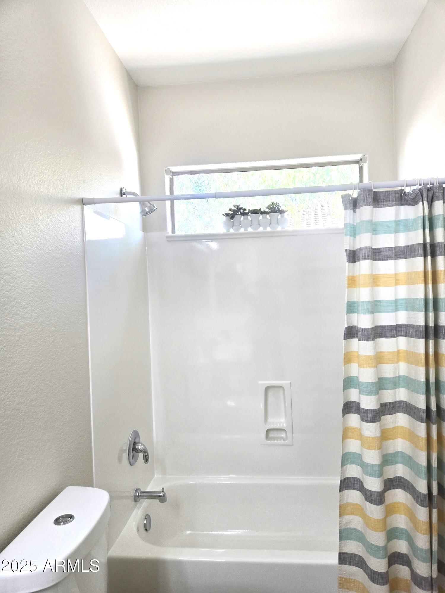 1187 South Hazel Street Gilbert, AZ 85296 - Photo 35 of 50 a bathroom with a bathtub and a shower