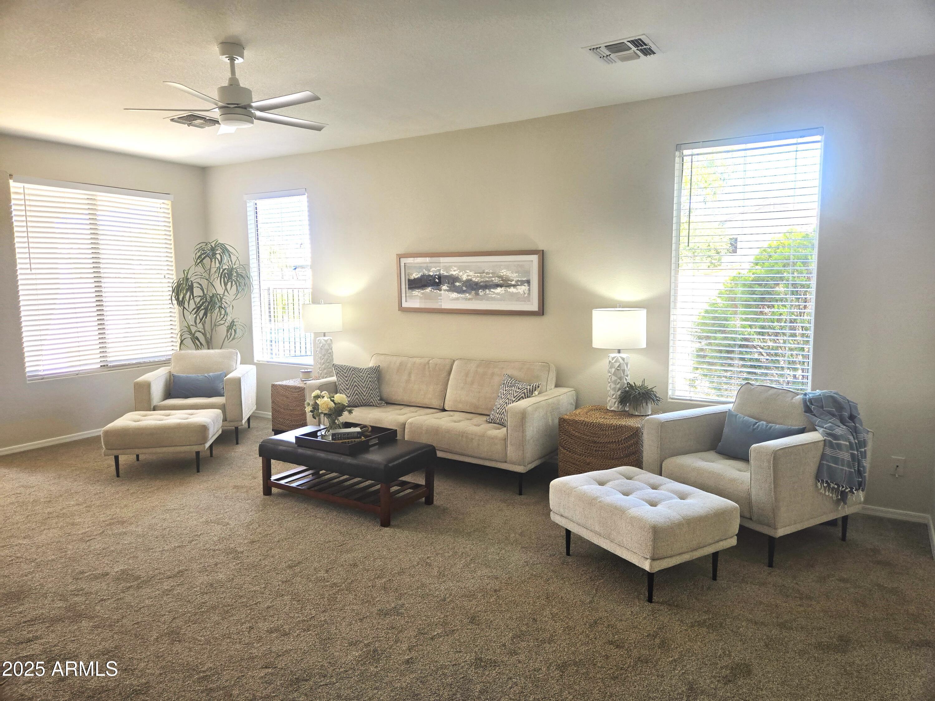 1187 South Hazel Street Gilbert, AZ 85296 - Photo 42 of 50 a living room with furniture and a large window