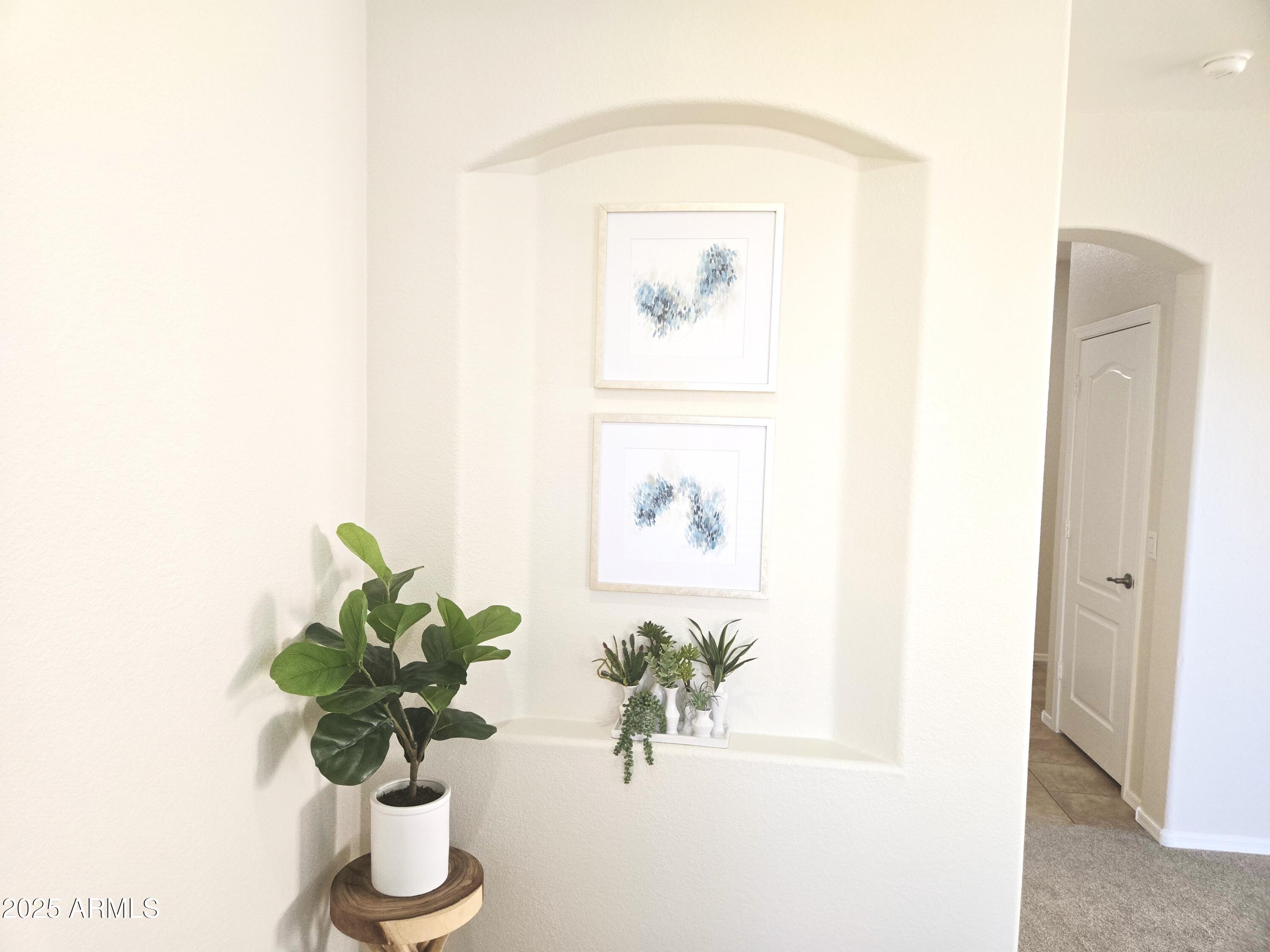 1187 South Hazel Street Gilbert, AZ 85296 - Photo 43 of 50 a vase of flowers sitting on a floor