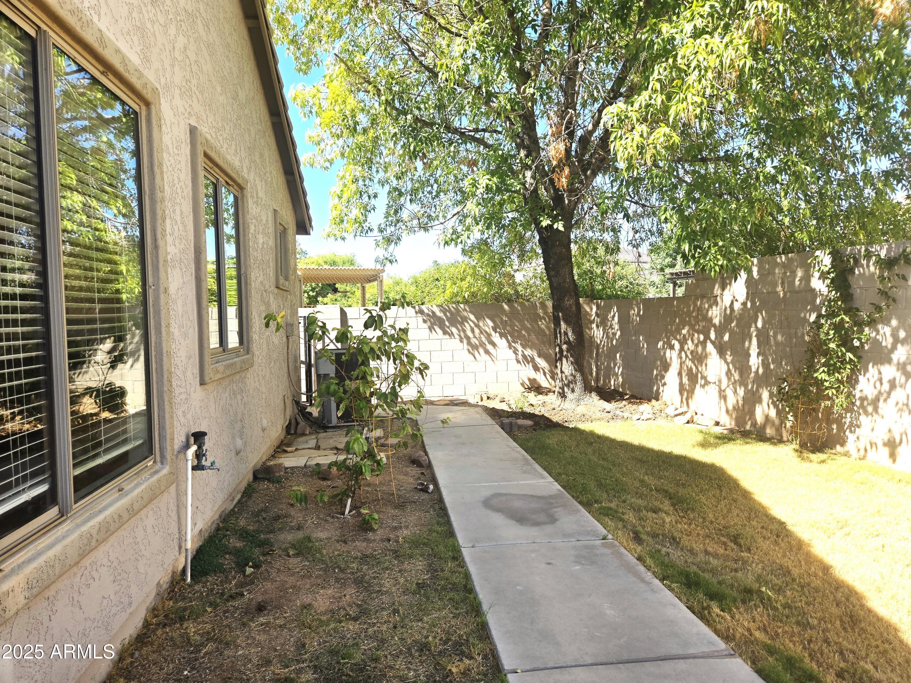 1187 South Hazel Street Gilbert, AZ 85296 - Photo 47 of 50 Walk way all around home in spacious sid