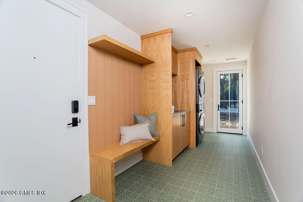 49 Salisbury Road Darien, CT 06820 - Photo 26 of 40 a view of a hallway with wooden shelves and closet