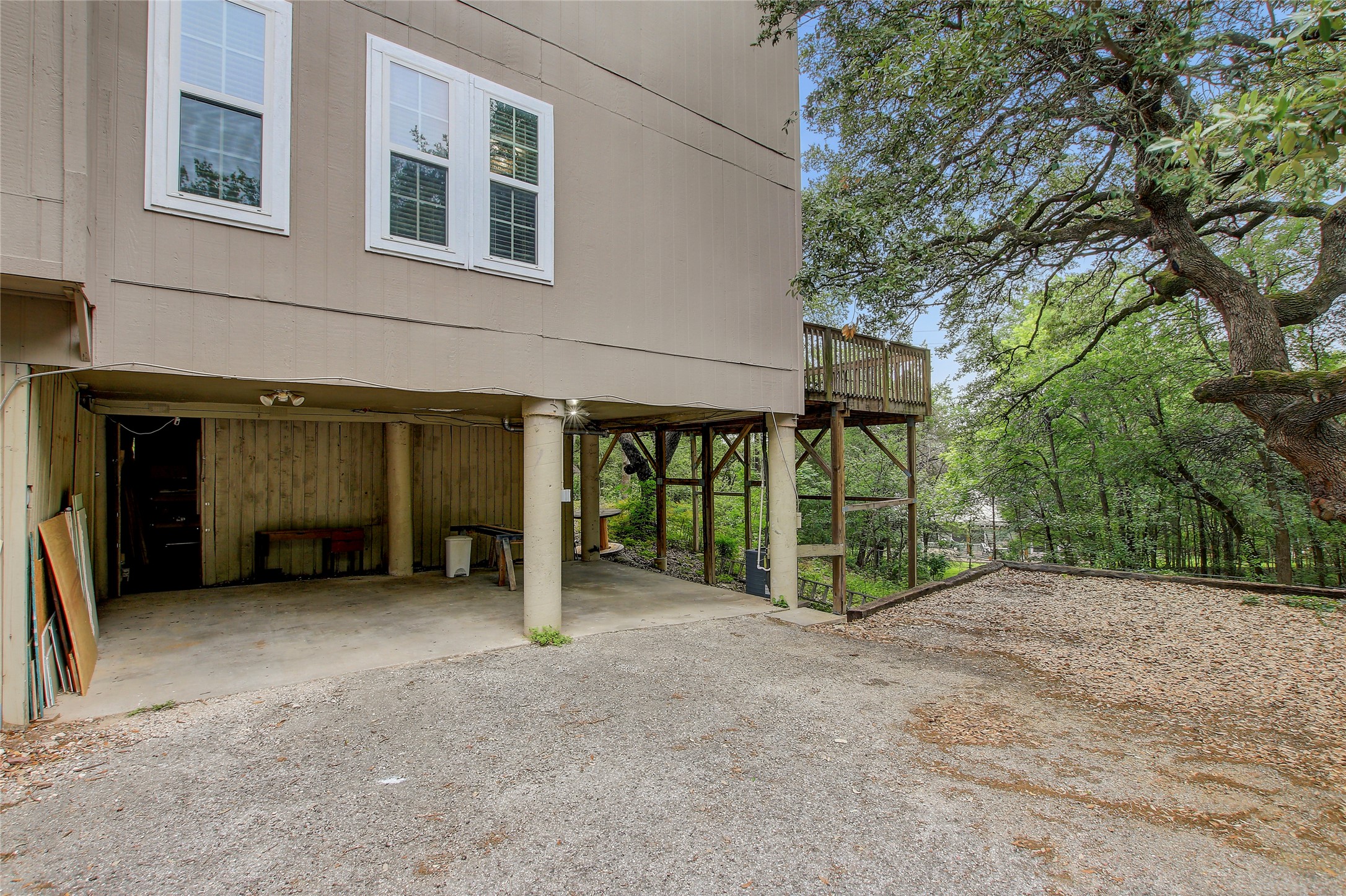 6902 Rifle Bend, Unit B Austin, TX 78736 - Photo 24 of 34 a view of a house with an outdoor space and seating