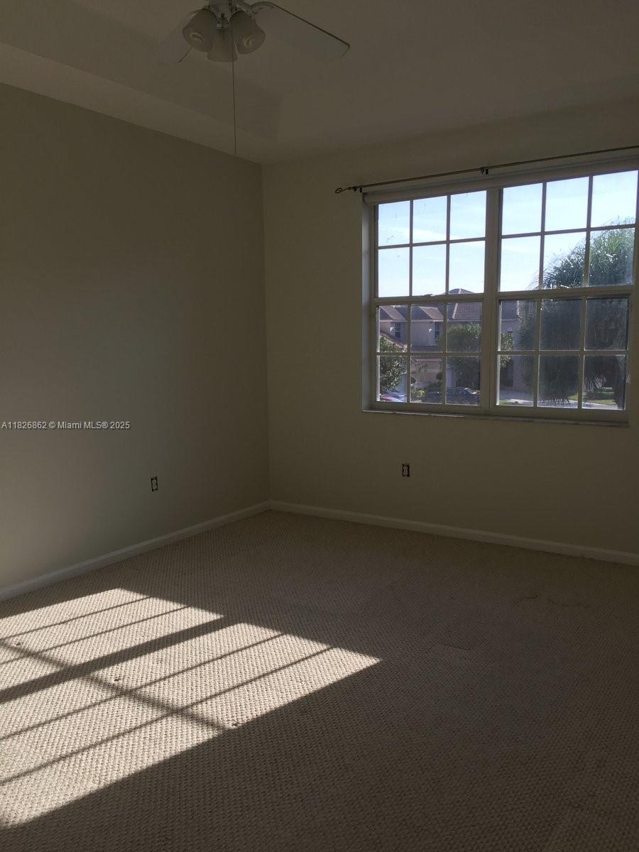 Boca del Mar Boca Raton, FL 33433 - Photo 6 of 11 an empty room with a empty space and windows