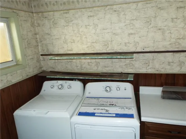 a utility room with dryer and washer