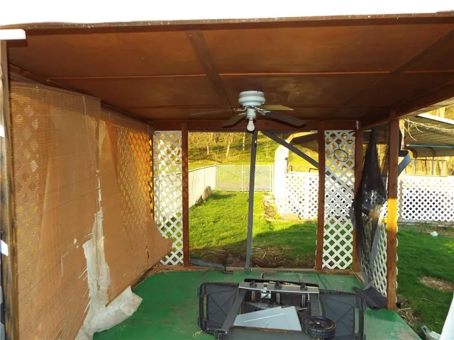 a backyard of a house with dishwasher and wooden floor