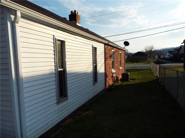 a stove top oven sitting inside of a kitchen