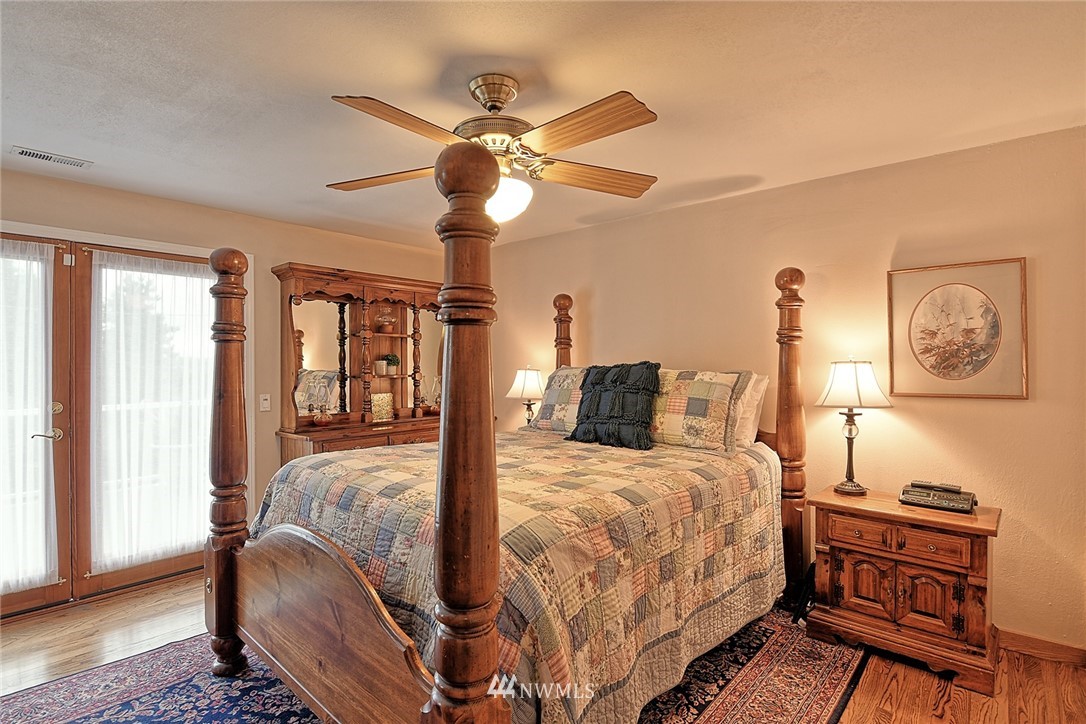 2104 Cedar Road Lake Stevens, WA 98258 - Photo 11 of 19 a bedroom with a bed and wooden floor