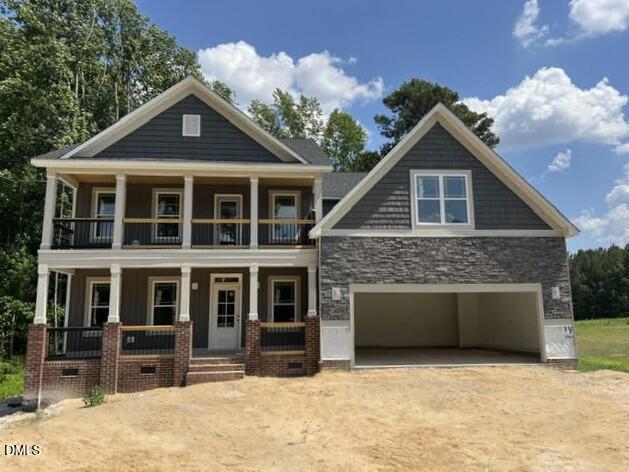 119 Big Pine Road Clayton, NC 27520 - Photo 2 of 21 a front view of a house with a yard and garage