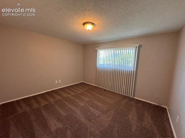 1922 Monterey Road Colorado Springs, CO 80910 - Photo 12 of 21 a view of an empty room with a window