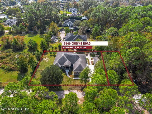 an aerial view of a house with a garden
