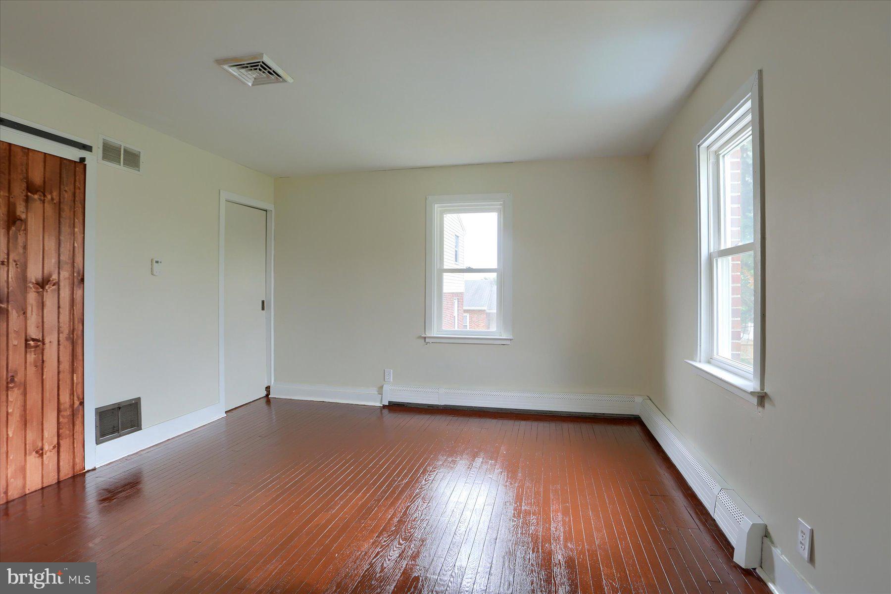 2158 Windsor Road Windsor, PA 17366 - Photo 13 of 30 an empty room with wooden floor and windows