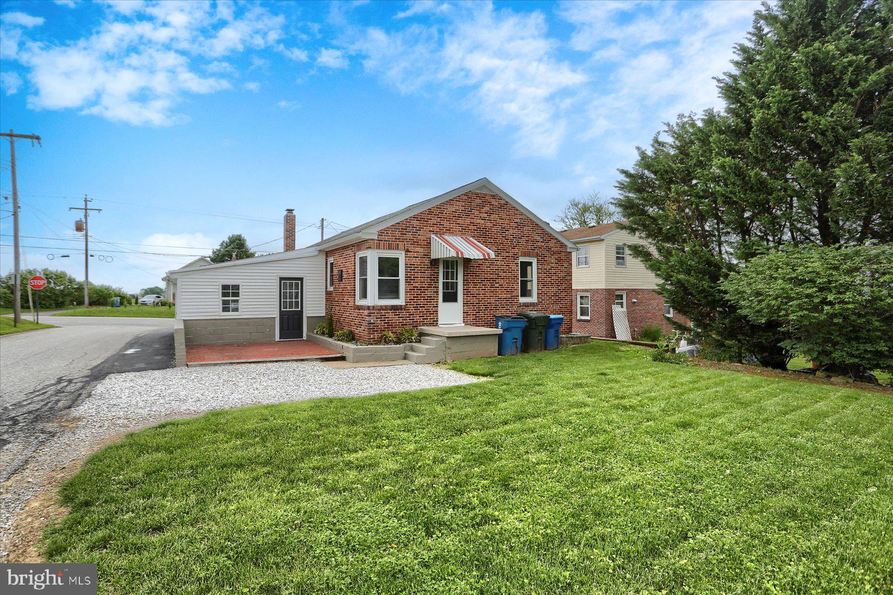 2158 Windsor Road Windsor, PA 17366 - Photo 3 of 30 a front view of a house with a yard and trees