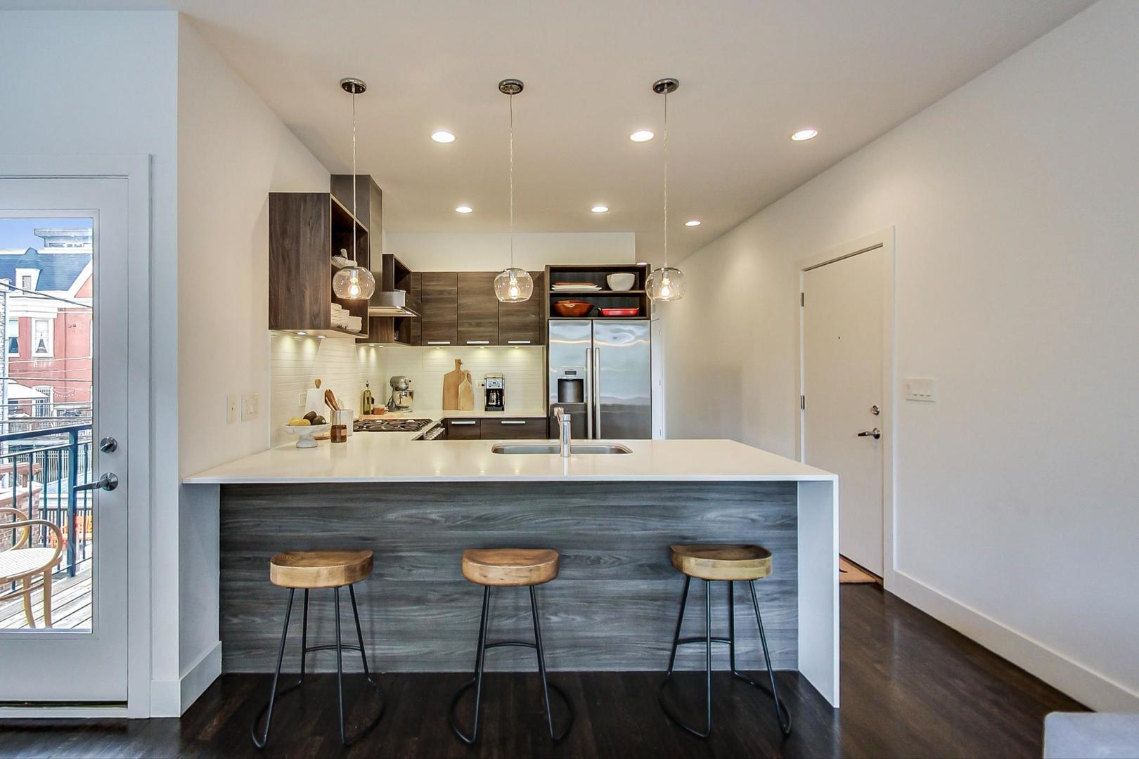 1944 West Thomas Street, Unit 2 Chicago, IL 60622 - Photo 2 of 28 a large kitchen with a table and chairs in it