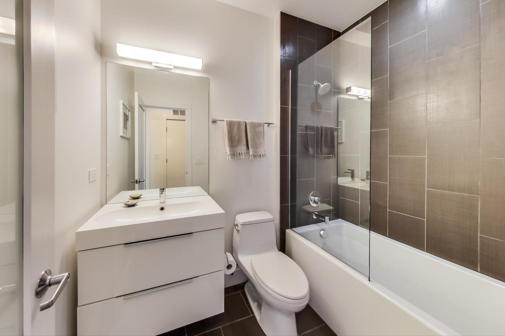 1944 West Thomas Street, Unit 2 Chicago, IL 60622 - Photo 14 of 28 a bathroom with a sink toilet tub and shower