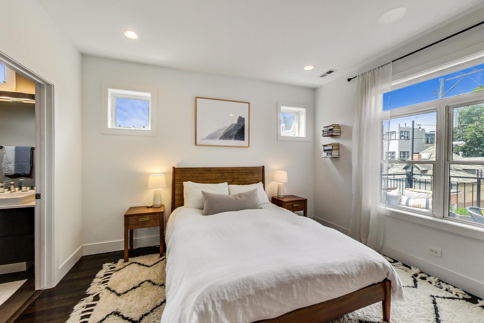 1944 West Thomas Street, Unit 2 Chicago, IL 60622 - Photo 16 of 28 a bedroom with a bed and a window