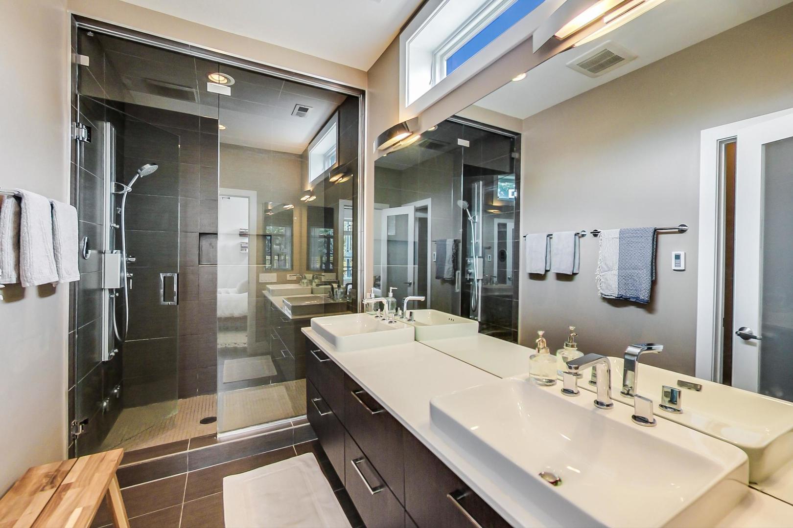 1944 West Thomas Street, Unit 2 Chicago, IL 60622 - Photo 18 of 28 a bathroom with a double vanity sink mirror and shower