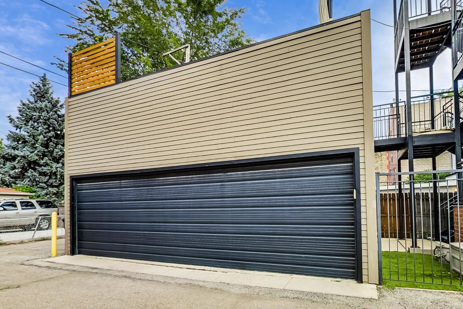 1944 West Thomas Street, Unit 2 Chicago, IL 60622 - Photo 27 of 28 a view of a small house with a garage