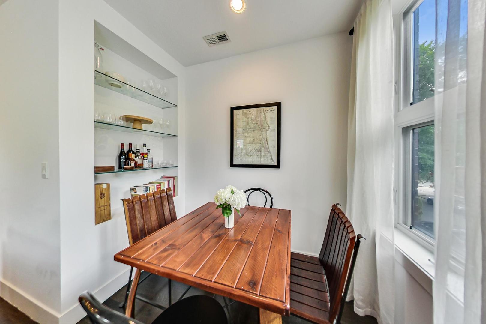 1944 West Thomas Street, Unit 2 Chicago, IL 60622 - Photo 6 of 28 a view of a dining room with furniture and wooden floor