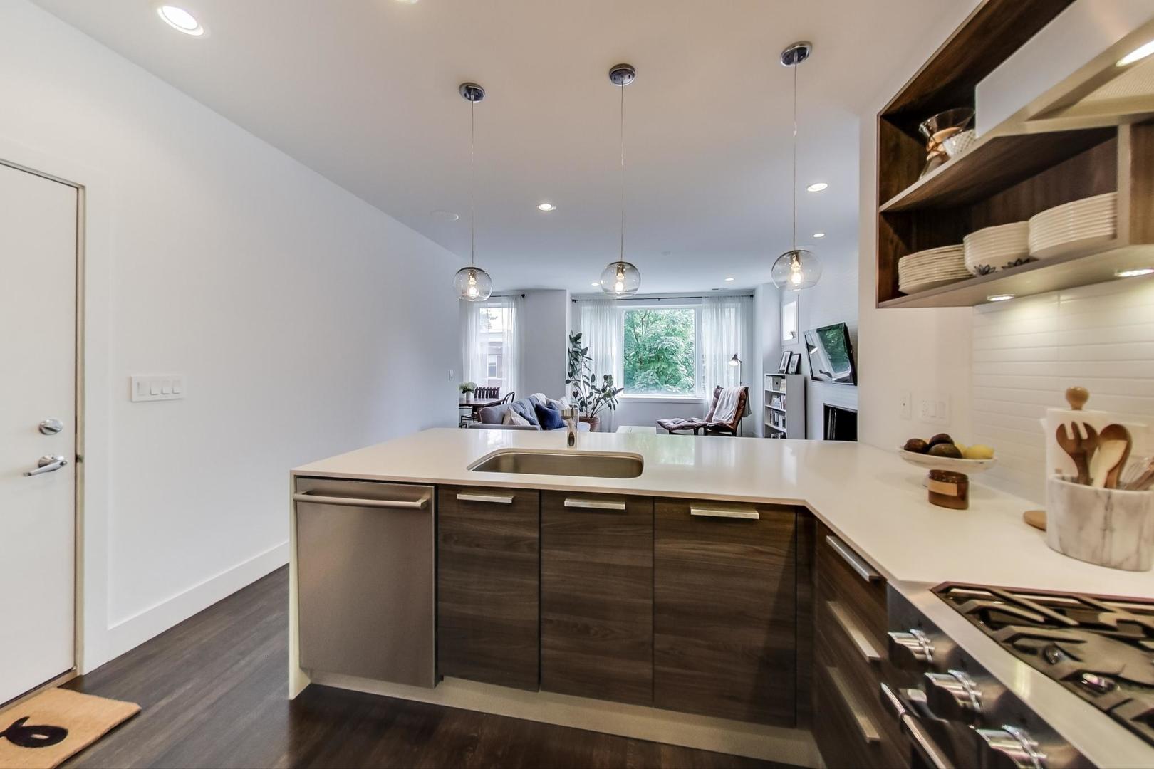 1944 West Thomas Street, Unit 2 Chicago, IL 60622 - Photo 10 of 28 a kitchen with a sink and cabinets