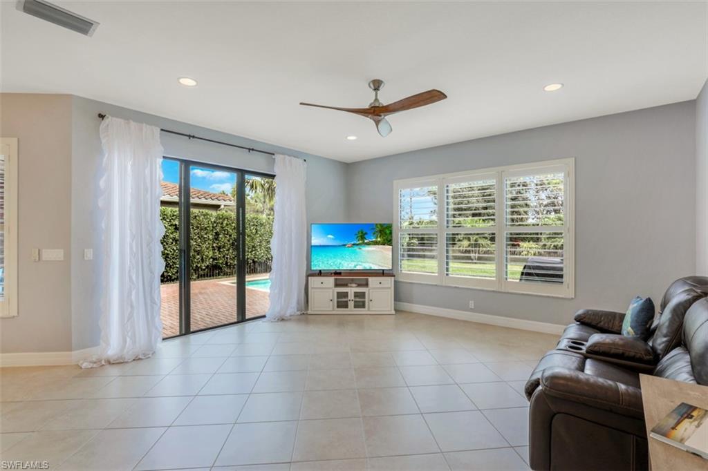 3082 Hudson Terrace Naples, FL 34119 - Photo 11 of 35 a living room with furniture and a flat screen tv