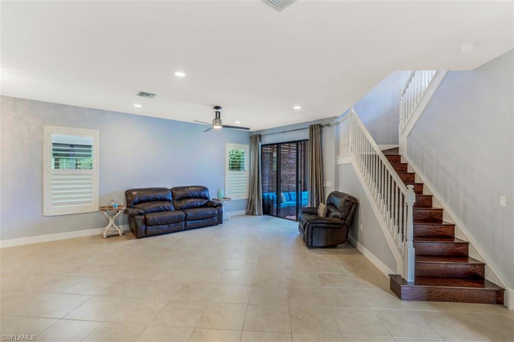 3082 Hudson Terrace Naples, FL 34119 - Photo 15 of 35 a living room with furniture and a window