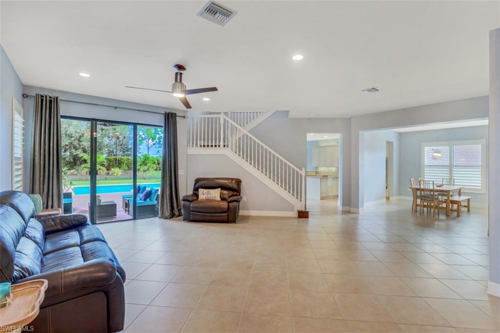 3082 Hudson Terrace Naples, FL 34119 - Photo 16 of 35 a living room with furniture and a large window