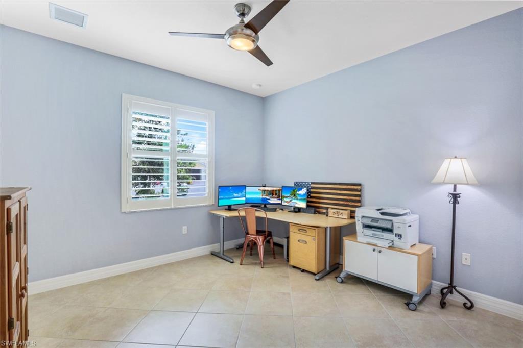 3082 Hudson Terrace Naples, FL 34119 - Photo 17 of 35 a view of a workspace with furniture and a window
