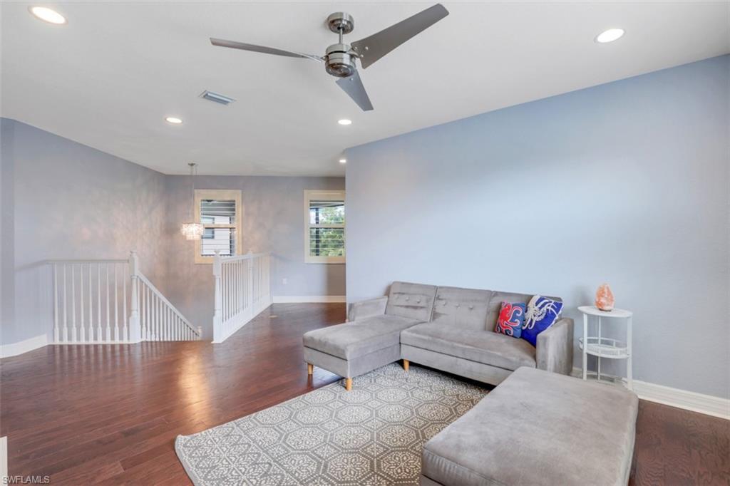 3082 Hudson Terrace Naples, FL 34119 - Photo 20 of 35 a living room with furniture and a wooden floor